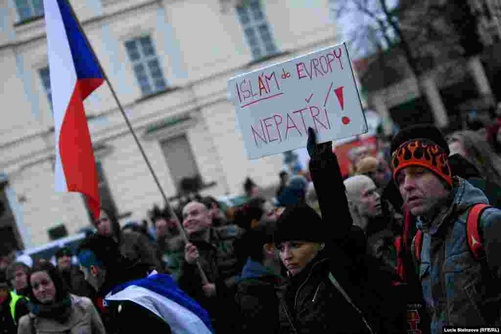 Czech Republic -- Anti-Islam demonstrators hold banners and Czech flags during a protest in Prague on January 16, 2015