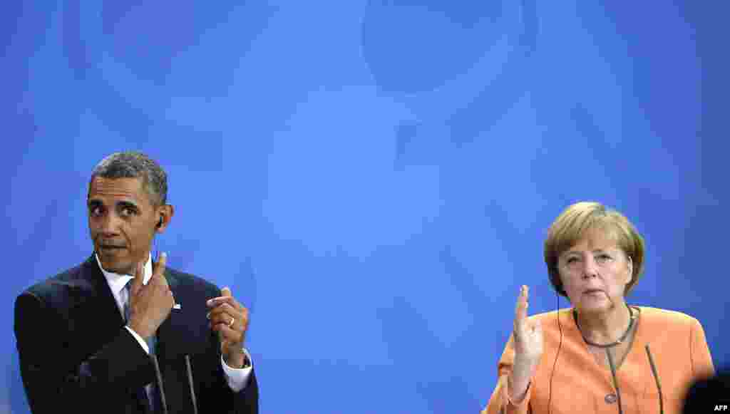 U.S. President Barack Obama and German Chancellor Angela Merkel gesture during a press conference at the Chancellery in Berlin in June 2013.