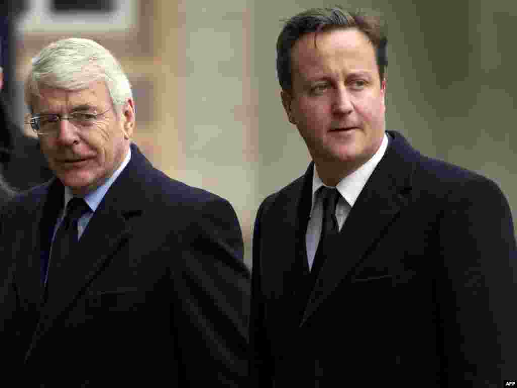 Czech Republic -- Britain's prime minister David Cameron (R) and former prime minister John Major arrive for the funeral service for former Czech president Vaclav Havel in Prague, 23Dec2011