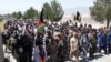 Civilians across Afghanistan are teaming up with security forces to push back the Taliban, such as in Khost Province on July 7. 