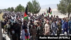 Civilians across Afghanistan are teaming up with security forces to push back the Taliban, such as in Khost Province on July 7. 
