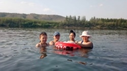 Swimming in Siberia: “You go out and within minutes you’re covered in sweat,” says Anna Sleptsova, a librarian who has lived in Verkhoyansk her whole life. “The summers are getting hotter every year.”