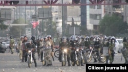 Iranian riot police on motorcycles patrol a Tehran street during protests in June 2009.