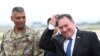 U.S. Secretary of State Mike Pompeo (R) walks with U.S. General Vincent K. Brooks, commander of United States Forces Korea, upon his arrival at Osan Air Base in Pyeongtaek, June 13, 2018