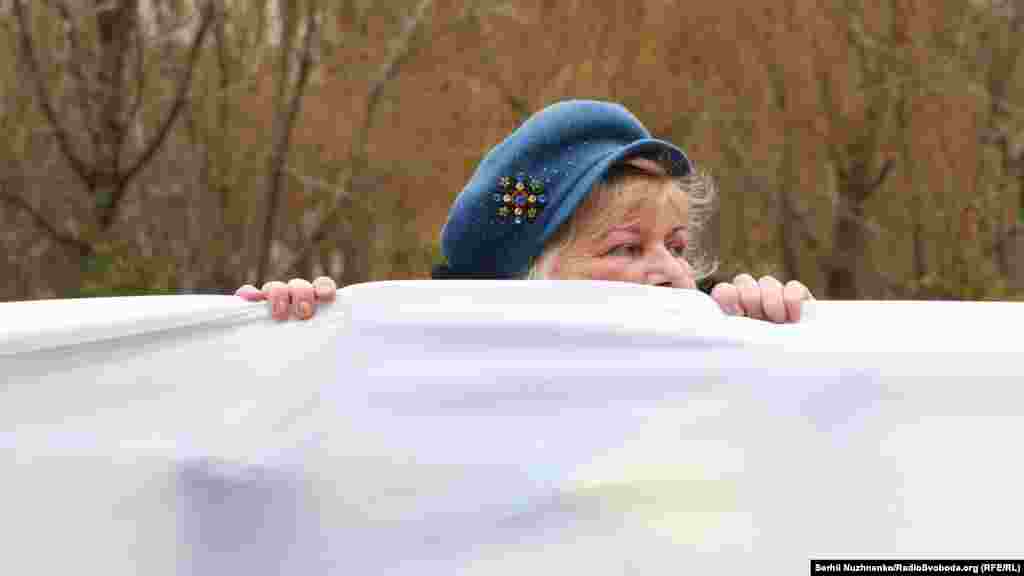 A protester attends a march organized by opposition politician Mikheil Saakashvili&#39;s Movement of New Forces party in Kyiv, Ukraine, on February 4. Thousands marched through the Ukrainian capital to call for President Petro Poroshenko&#39;s resignation. On February 12, Ukrainian security forces detained Saakashvili in Kyiv and deported him. (Serhii Nuzhnenko, RFE/RL)