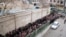 Low-income Iranians line up to receive food assistance in southern Tehran, Feb. 2014