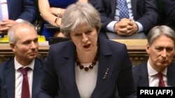 British Prime Minister Theresa May makes a statement on March 14 in the House of Commons about London's plans to expel 23 Russian diplomats following the poisoning of a former Russian spy in the English city of Salisbury.