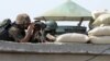 Pakistani soldiers take position at post in North Waziristan in a file photo.