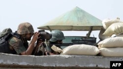 Pakistani soldiers take up positions at post during a military operation against Taliban militants in the town of Miranshah in North Waziristan on July 2.