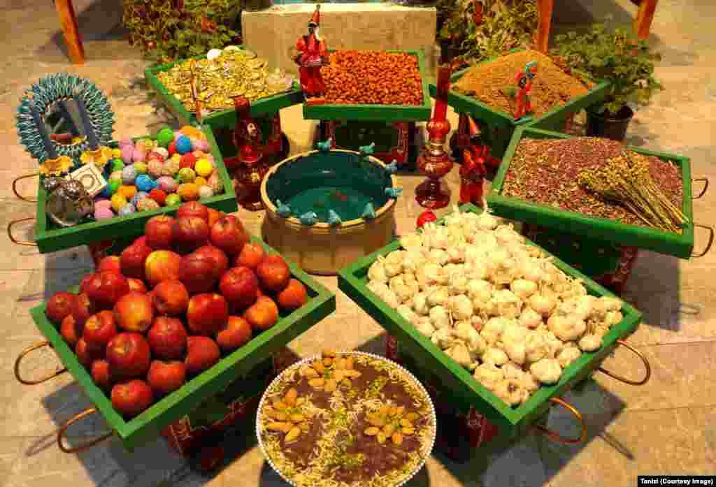 Fruit, eggs, spices, and sweets make up a Norouz display in the Iranian capital, Tehran.