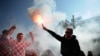 Croatian soccer fans shout slogans prior to their team&#39;s World Cup 2014 qualification match against Serbia in Zagreb. (AFP/Dimitar Dilkoff)