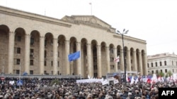 The crowd at the Tbilisi rally in front of parliament was estimated in the tens of thousands, with more still filing toward the event.