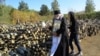 Священник Алексий Александров окропляет снаряды в воинской части