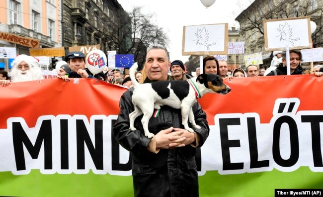 Supporters of the Two-Tailed Dog Party rally on the streets of Budapest in March 2018.