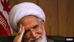 "I will never withdraw," says Mehdi Karrubi.