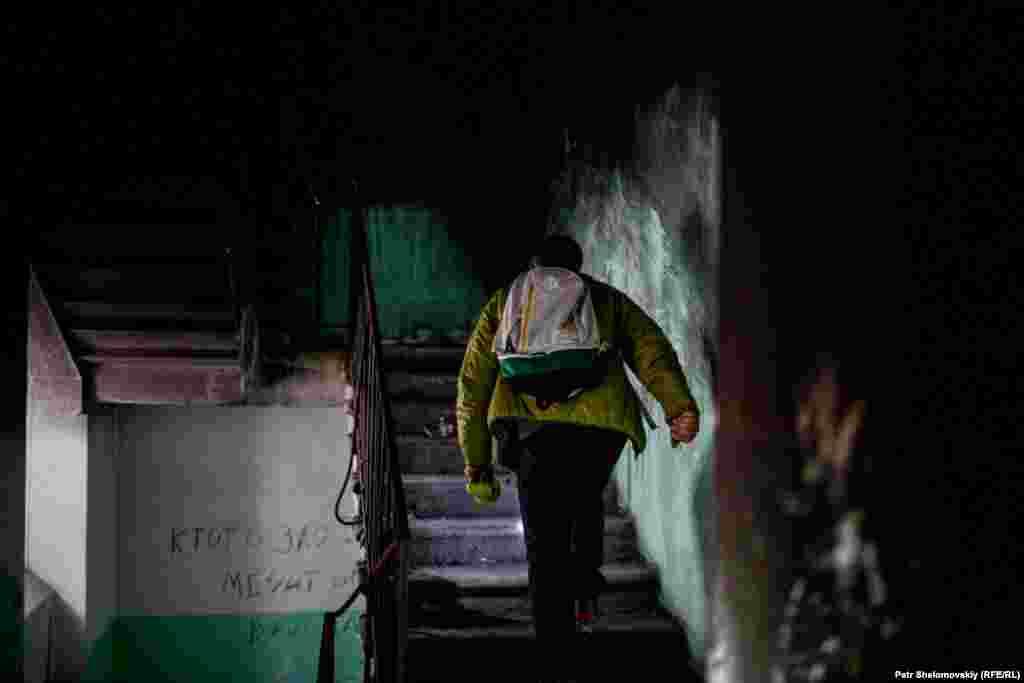 Filip Muskevitch walks through the damaged hallway of the Winter Hotel.