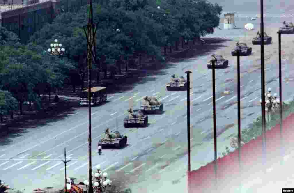 An unarmed man stands in front of a column of tanks on the Avenue of Eternal Peace on June 5. The tanks moved around him. The man&#39;s identity has not been confirmed and little is known about his fate after the standoff.