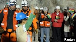 Bolivian national Carlos Mamani celebrates as he arrives as the fourth miner to be hoisted to the surface in Copiapo on October 13.