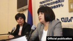 Armenia - Deputy Economy Minister Karine Minasian (R) at a news conference in Yerevan.