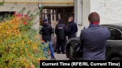 Police blocked the entrance to the building where Communist Party lawyers were preparing a lawsuit on September 28. 