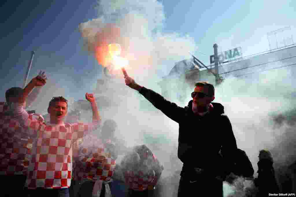 Croatian soccer fans shout slogans prior to their team&#39;s World Cup 2014 qualification match against Serbia in Zagreb. (AFP/Dimitar Dilkoff)