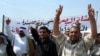 Relatives of Iraqi detainees arrested by British forces protest on June outside a British military base in Al-Basrah