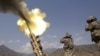 A 155mm round is fired from a Howitzer at insurgents at Forward Operating Base Bostick in Kunar Province on July 8.