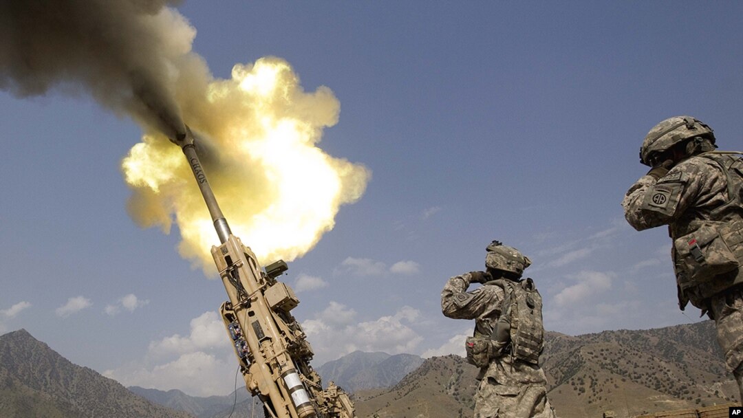 A 155mm round is fired from a Howitzer at insurgents at Forward Operating Base Bostick in Kunar Province on July 8.
