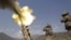 A 155mm round is fired from a Howitzer at insurgents at Forward Operating Base Bostick in Kunar Province on July 8.
