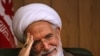 Reformist Cleric Says He Won't Stand Down In Iran Vote