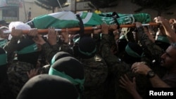 The funeral of Saeed Attallah, a leader in Hamas's armed wing, is held on October 5 in the northern Lebanese city of Tripoli after he and his family were killed in an Israeli strike. 