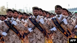 FILE: Members of Iran's Islamic Revolutionary Guards Corps (IRGC) march during the annual military parade marking the anniversary of the outbreak of the devastating 1980-1988 war with Saddam Hussein's Iraq, in Tehran, September 2018.