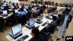 Afghan Election Commission workers gather election information from across the country at a counting center in Kabul on April 8.