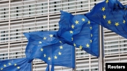 Belgium - European Union flags flutter outside the EU Commission headquarters in Brussels, September 28, 2022. 