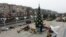 Municipal workers set up a Christmas tree on a square in Mariupol, in the Russian-controlled Donetsk region of eastern Ukraine, on December 24.