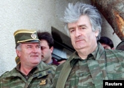 Bosnian Serb wartime leader Radovan Karadzic (right) and his general, Ratko Mladic, in April 1995. Both men received lengthy sentences for the gravest crimes that came under the purview of the Hague tribunal.