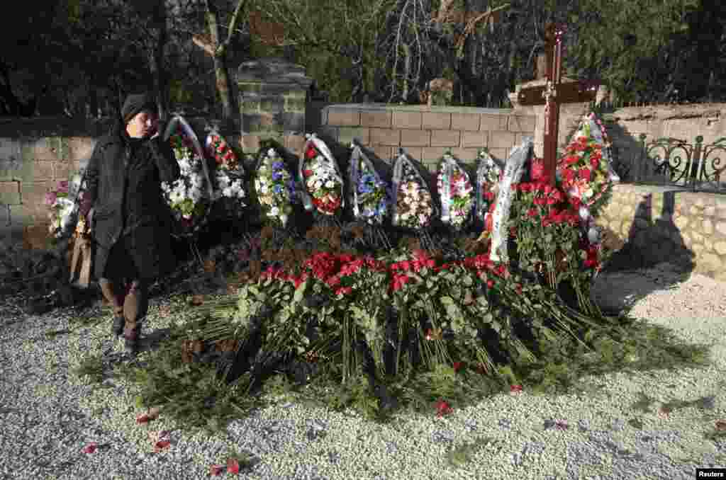 An unmarked grave believed to be that of Viktor Yanukovych, the son of ousted Ukrainian President Viktor Yanukovych, is seen at the Brotherhood Cemetery in Sevastopol, Crimea. He is believed to have drowned after a minivan he was driving plunged through ice on a Siberian lake. (Reuters/Pavel Rebrov)