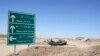 Iraq -- The wreckage of a car belonging to Islamic State militants lies along a road after it was targeted by a US air strike at the entrance to the Mosul Dam, northern Iraq, August 21, 2014