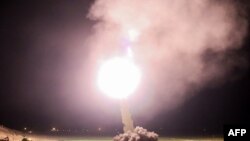 Members of the IRGC launch a missile from an undisclosed location in western Iran toward Islamic State bases in Syria in 2017.