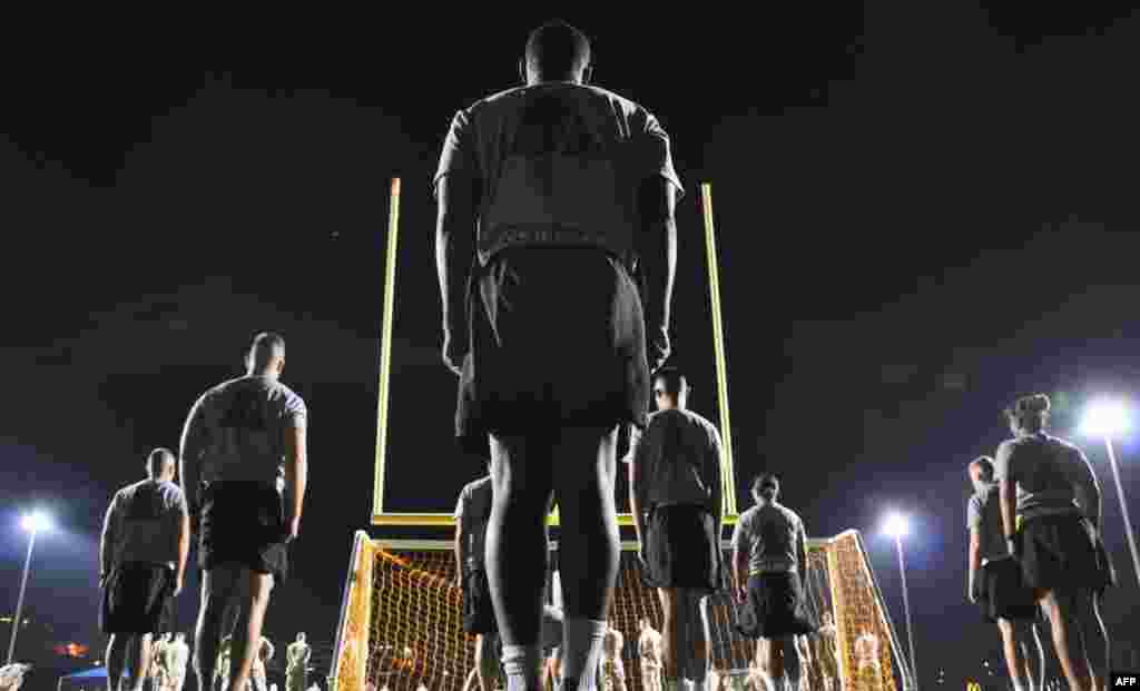 OCTOBER 18, 2012 -- U.S. soldiers perform physical training in the predawn hours at the U.S. Naval Base at Guantanamo Bay, Cuba. (AFP/Michelle Shephard)