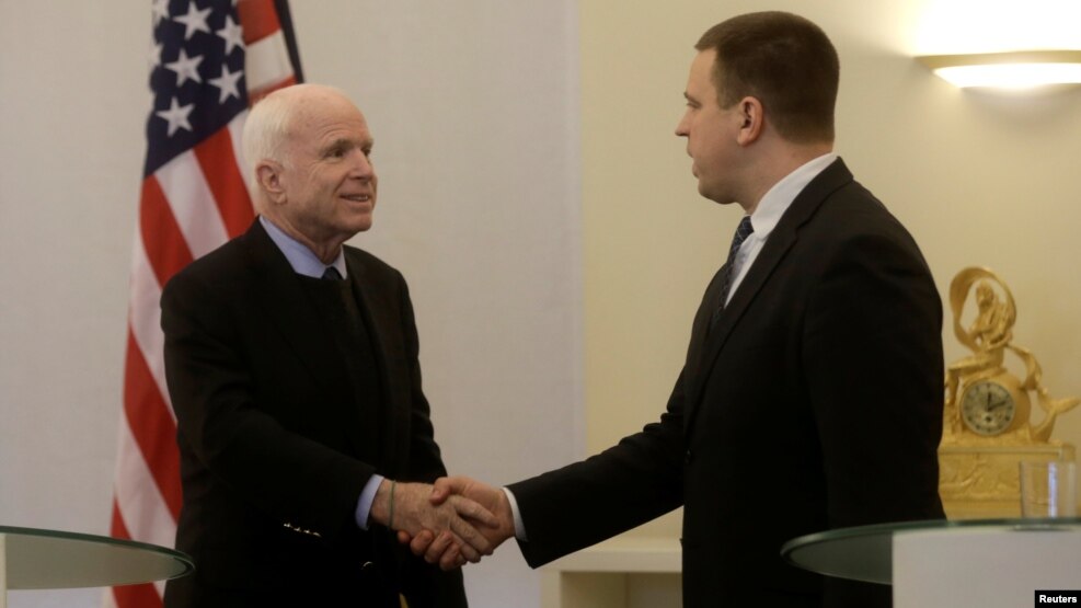 U.S. Senator John McCain shakes hands with Estonia's Prime Minister Juri Ratas in Tallinn, Estonia, on December 27.