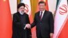 Iranian President Ebrahim Raisi (left) and Chinese President Xi Jinping meet in Beijing in February 2023. How much sway does China actually have over Iran and the Huthis? And would it even want to use it?