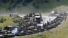A column of Russian armored vehicles is seen on its way to the South Ossetian capital of Tskhinvali on August 9, 2008.