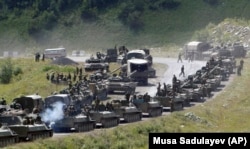 A column of Russian armored vehicles is seen on its way to the South Ossetian capital, Tskhinvali, on August 9, 2008.