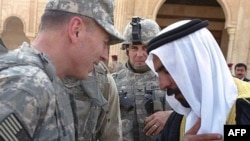 Al-Anbar provincial tribe leader Sheikh Abdul-Sattar Abu Risha with U.S. commander General David Petraeus (file photo)