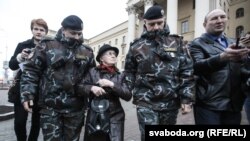 Protesters are detained at a demonstration in front of KGB headquarters in Minsk "to support arrested patriots" on March 31.