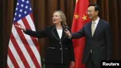 Chinese Foreign Minister Yang Jiechi and visiting U.S. Secretary of State Hillary Clinton in Beijing