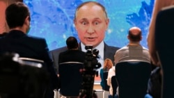 Russian President Vladimir Putin speaks via video call during his annual news conference in Moscow on December 17.