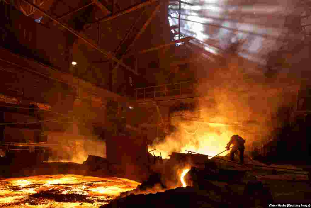 A foundry worker at Kosaya Gora Ironworks, just south of Moscow. Industrial photographer Viktor Macha says that "sooner or later, we will know this kind of work only through pictures and movies."