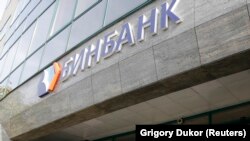 A man walks out of Russia's B&N Bank headquarters in central Moscow on September 20.